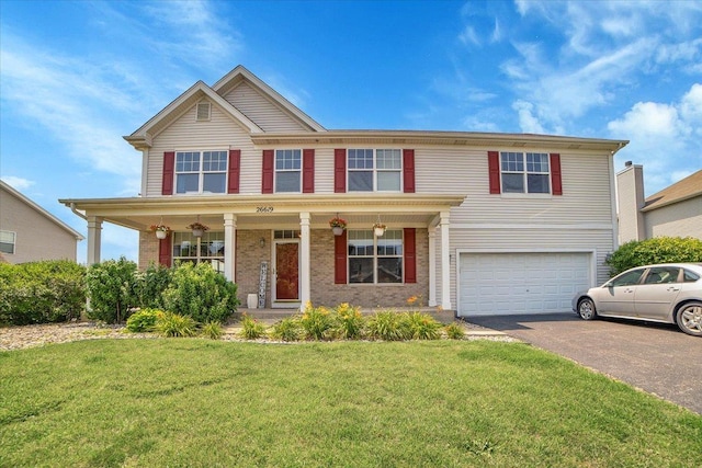 view of front facade with a garage, aphalt driveway, a front lawn, a porch, and brick siding