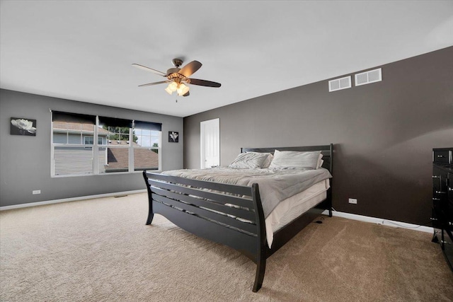 bedroom featuring carpet, visible vents, ceiling fan, and baseboards