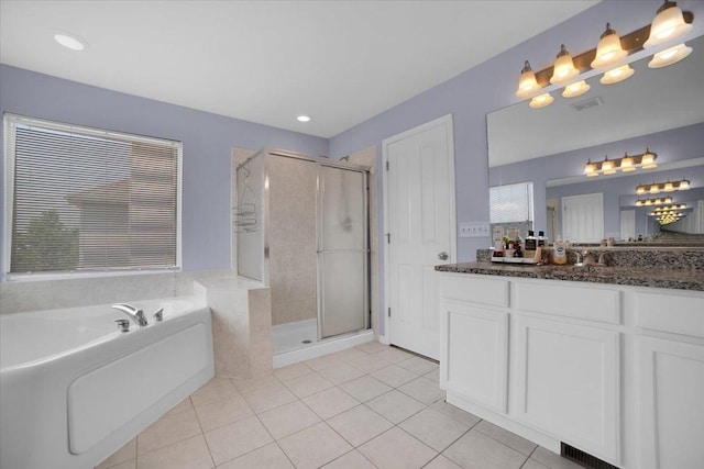 bathroom with a garden tub, a stall shower, tile patterned flooring, and visible vents