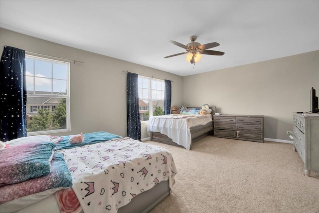 bedroom featuring a ceiling fan, carpet, and baseboards