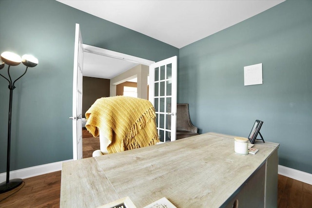 office area with dark wood-style flooring, french doors, and baseboards