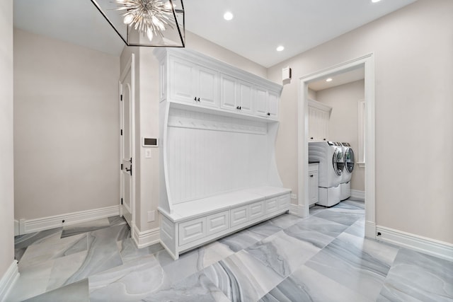 mudroom featuring marble finish floor, recessed lighting, washing machine and clothes dryer, and baseboards