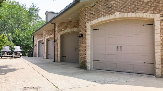 garage with concrete driveway