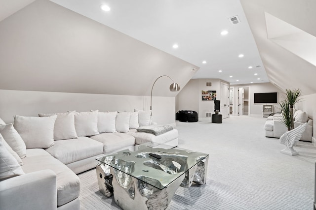 carpeted living area with vaulted ceiling, visible vents, and recessed lighting