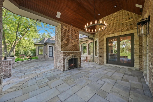 view of patio / terrace featuring an outdoor brick fireplace