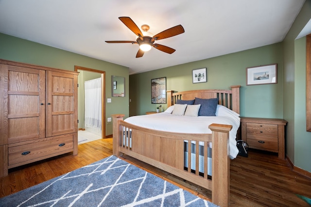 bedroom with ceiling fan, baseboards, and wood finished floors