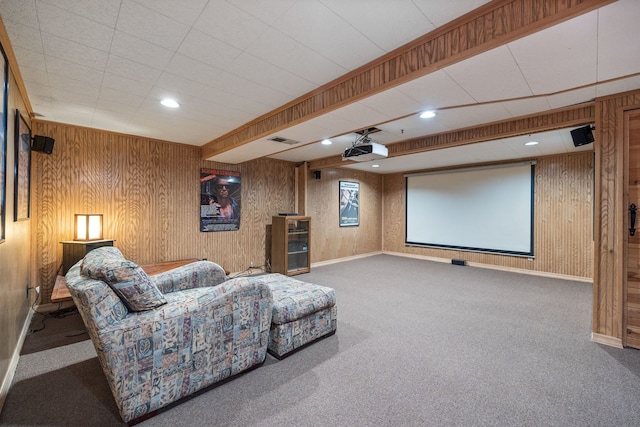 home theater with wooden walls, recessed lighting, visible vents, baseboards, and carpet