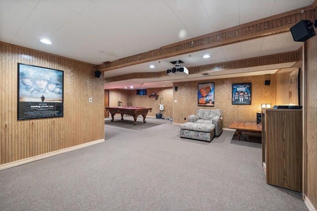 interior space featuring carpet floors, beam ceiling, recessed lighting, wood walls, and baseboards