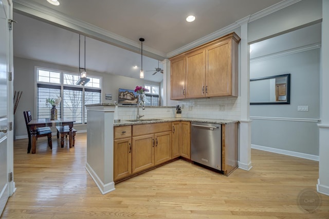 kitchen with crown molding, backsplash, a sink, dishwasher, and a peninsula