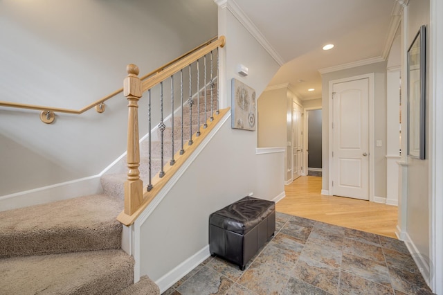 stairway featuring ornamental molding, recessed lighting, stone tile flooring, and baseboards