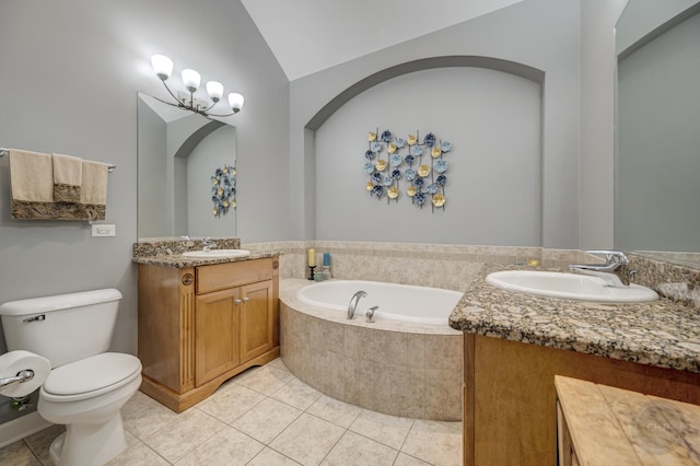 bathroom with tile patterned flooring, a sink, and a bath