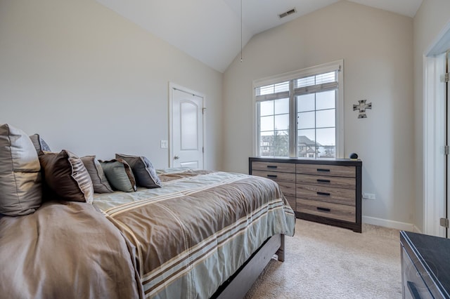 bedroom featuring vaulted ceiling, baseboards, visible vents, and light colored carpet