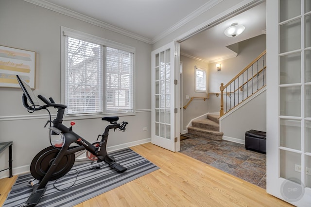 workout area with baseboards, french doors, wood finished floors, and crown molding