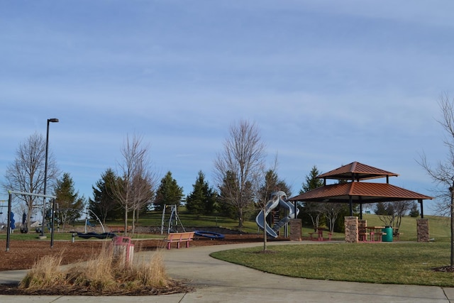 view of community featuring a yard, playground community, and a gazebo