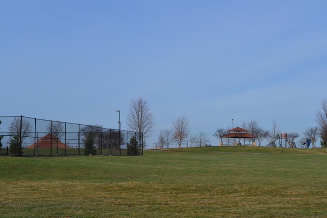 view of yard featuring fence and a gazebo