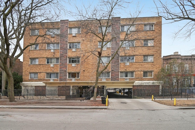 view of property with fence