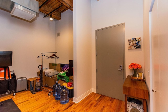 interior space with visible vents and wood finished floors