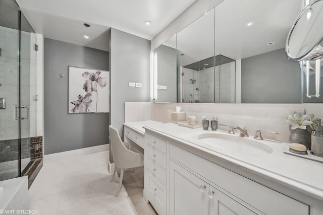 full bathroom featuring recessed lighting, a shower stall, vanity, and tile patterned floors