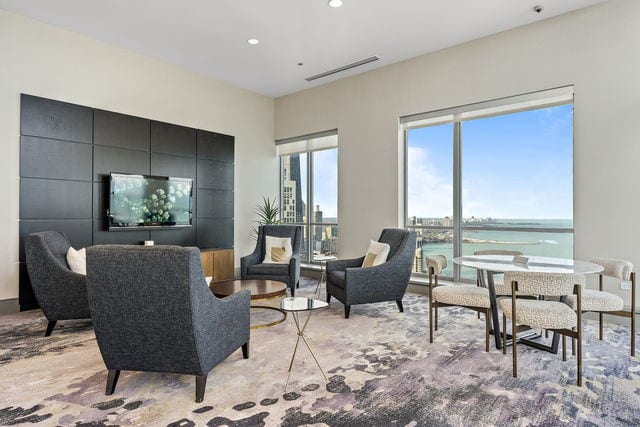 living area featuring visible vents and recessed lighting