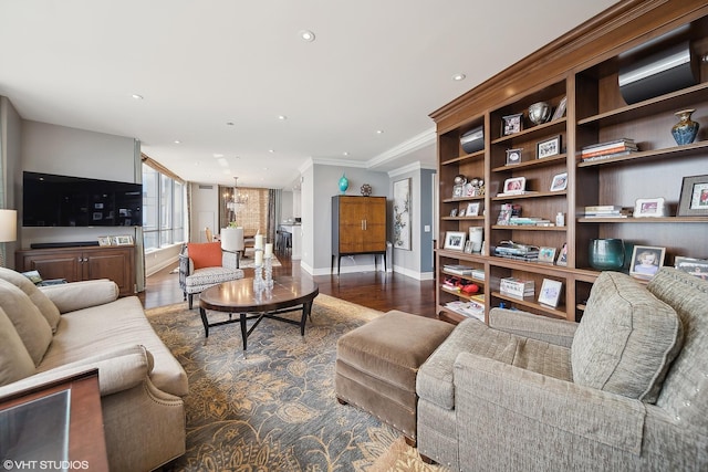 living room featuring recessed lighting, wood finished floors, baseboards, ornamental molding, and an inviting chandelier