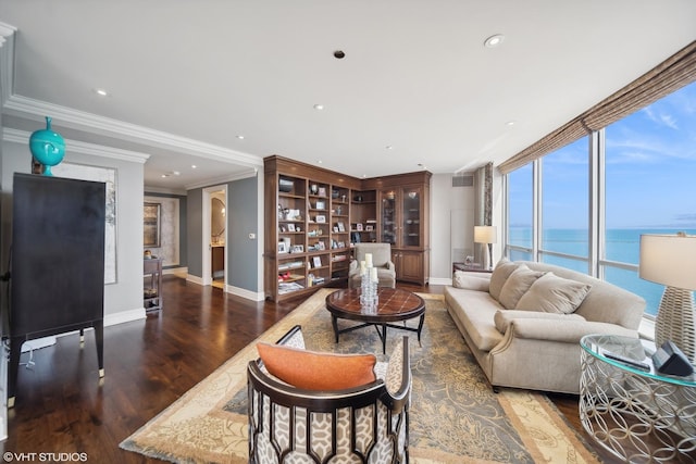 living room featuring crown molding, a water view, wood finished floors, and baseboards