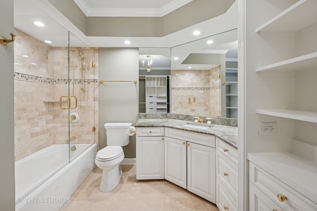 full bathroom with vanity, toilet, combined bath / shower with glass door, and ornamental molding