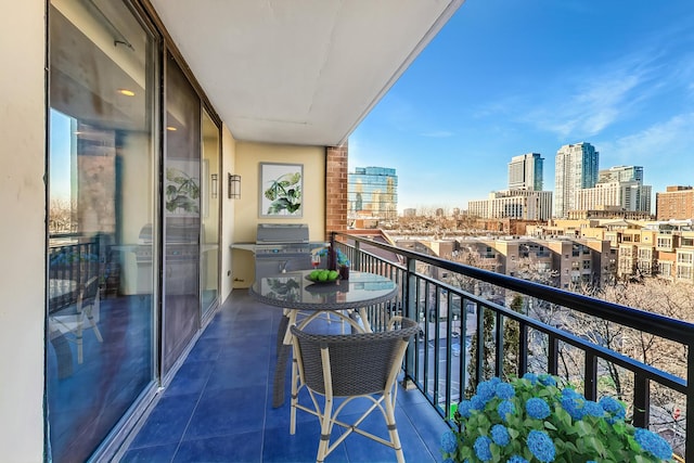 balcony with a view of city and grilling area