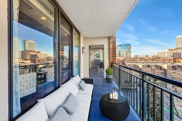 balcony with a view of city and outdoor lounge area