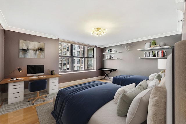 bedroom featuring wood finished floors and crown molding