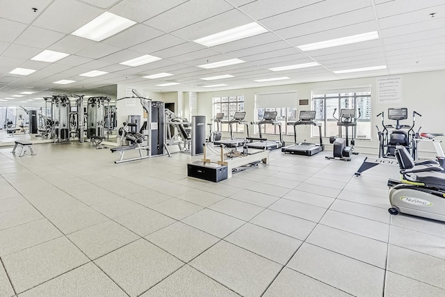 exercise room featuring a drop ceiling