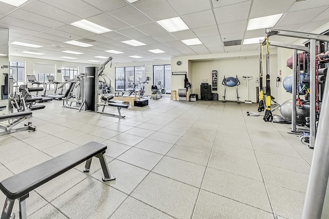 workout area with a drop ceiling