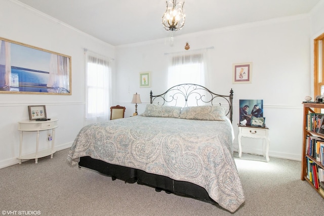 carpeted bedroom with multiple windows, baseboards, and crown molding