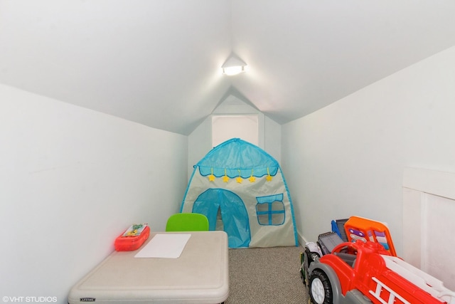 bedroom with vaulted ceiling and carpet