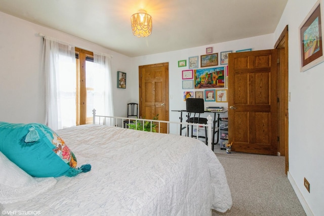 bedroom with carpet and baseboards