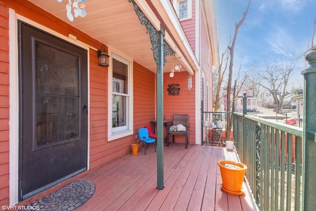 wooden terrace with a porch