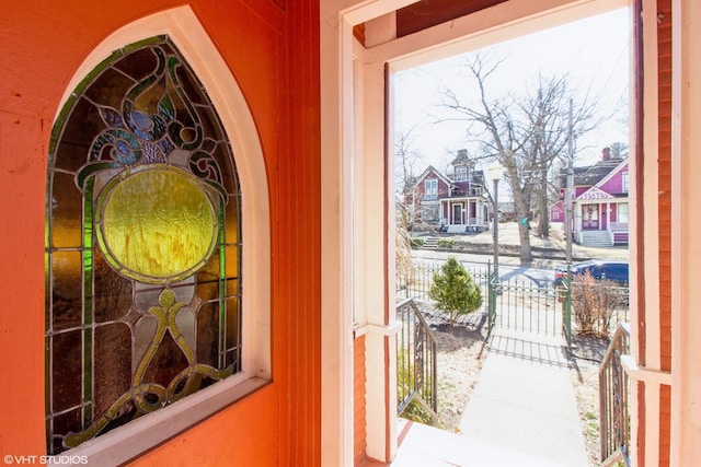 doorway to outside with a residential view