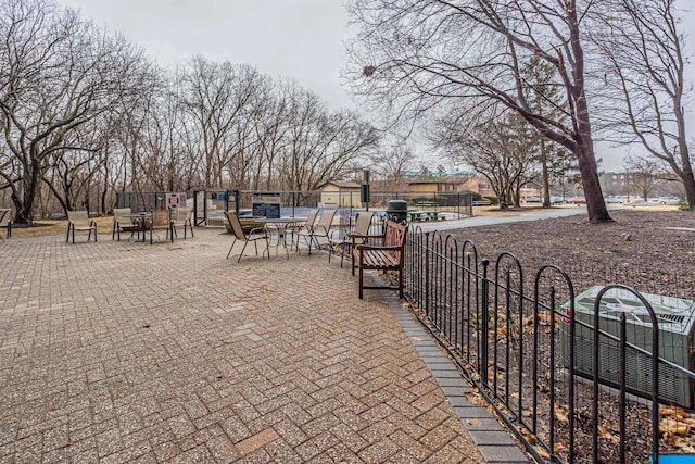 view of community featuring fence