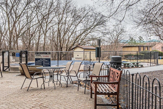 view of patio featuring fence