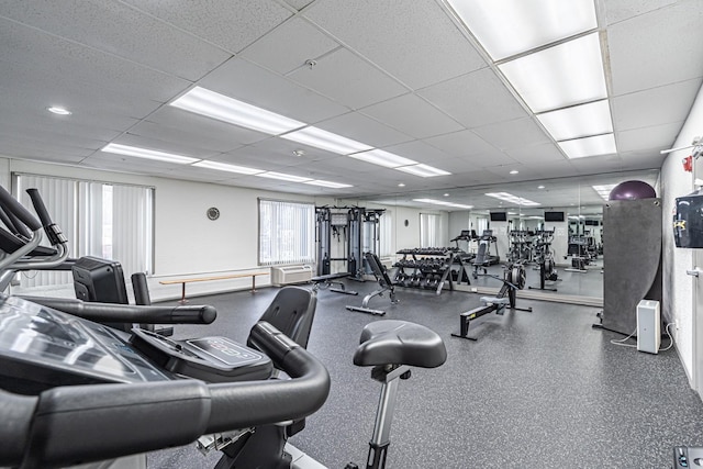 gym featuring a paneled ceiling