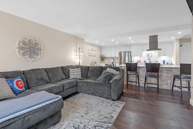 living area featuring dark wood-style floors and recessed lighting