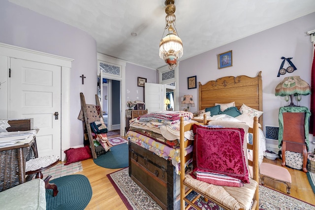 bedroom with wood finished floors