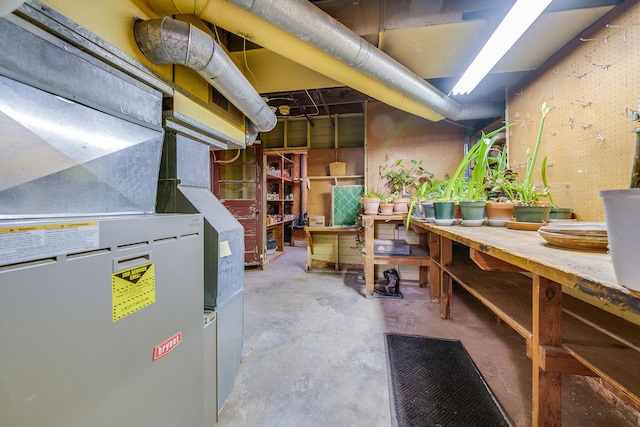 unfinished basement with a workshop area