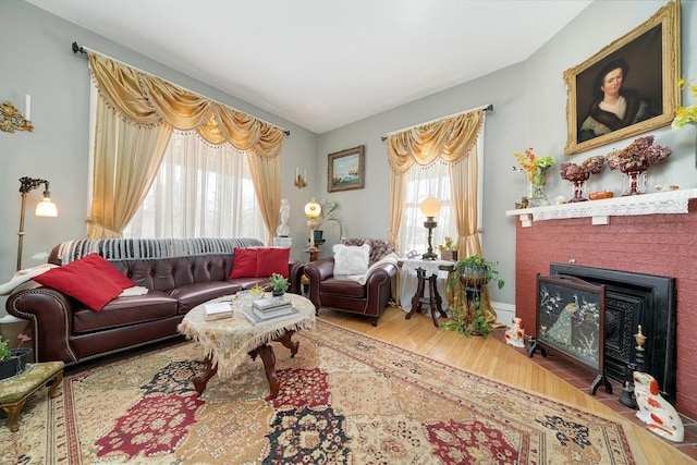 living room featuring a fireplace and wood finished floors