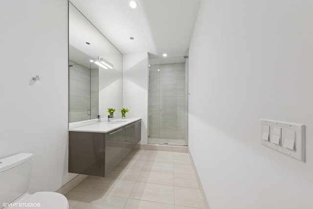 full bathroom featuring recessed lighting, toilet, a shower stall, vanity, and baseboards