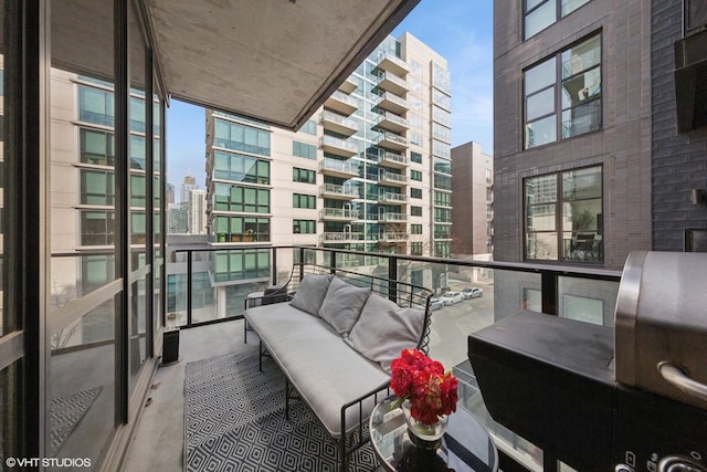 balcony featuring a view of city and an outdoor living space