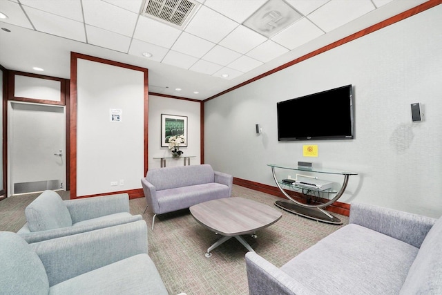 carpeted living room featuring baseboards, visible vents, crown molding, a paneled ceiling, and recessed lighting