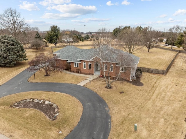 view of front of house featuring aphalt driveway and brick siding