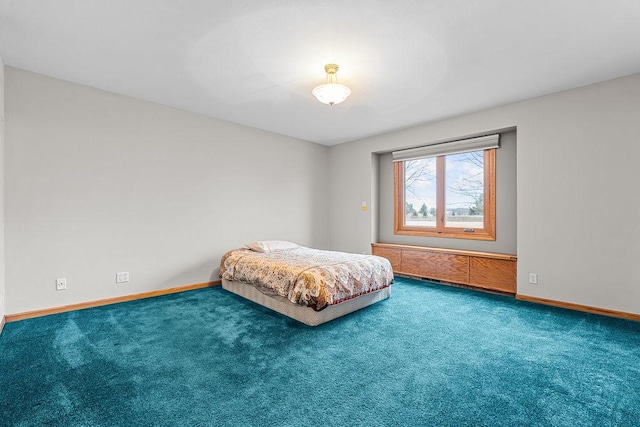 carpeted bedroom with baseboards