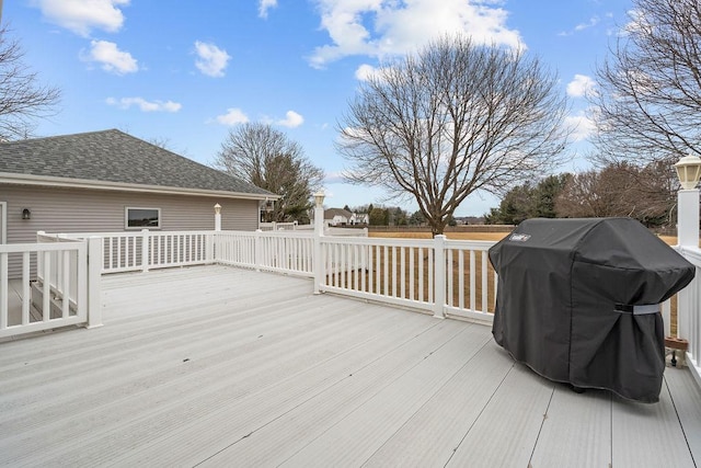 wooden terrace featuring area for grilling