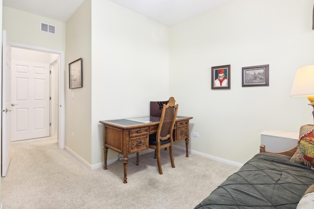 office with carpet, visible vents, and baseboards